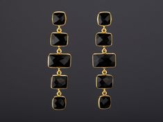 This pair of chained black onyx string earrings with its shining darkness would be a great reward for yourself or a nice gift for your mother or best friend. Each one has a string of five black onyx stones set in gold plated bezels: 1. Stones : five square/rectangular black onyx stones connected in a dangled chain each stone is about 11 x 10mm 2. earring total length ~ 64 mm 3. bezel material: 24k gold plated over sterling silver 4. earring post: 24k gold plated over sterling silver 5. if sendin Luxury Black Onyx Earrings, Elegant Rectangular Jewelry For Evening, Black Gemstone Jewelry For Party, Elegant Onyx Jewelry For Evening, Elegant Rectangular Linear Earrings As Gift, Elegant Rectangular Linear Earrings For Gift, Elegant Black Long Drop Jewelry, Elegant Black Jewelry For Formal Occasions, Elegant Onyx Dangle Earrings