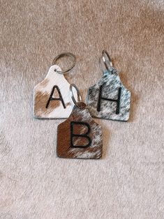 Leather Ear Tag Keychain, Cowhide Crafts Diy, Cowhide Keychain, Western Keychain, Cattle Tags, Cow Tag, Iron Rose, Western Bedroom, Hidden Colors