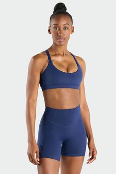 The Hyper-Power Strappy Sports Bra is ultimate for conquering any fitness challenge, whether it's a gym session or a morning run. This women’s workout sports bra features a high-support fit that contours to your body with a strappy back design. Our fabric is sleek and cooling, ensuring you stay comfortable even during your most intense workouts. The ultra-soft hand feel adds an extra layer of luxury to your routine, while the fabric's sweat-wicking properties keep you dry and focused. Functional Sports Bra With Built-in Padding For Running, Functional Medium Support Sports Bra Squat Proof, Running Sports Bra With Built-in Padding, Supportive Functional Sports Bra For High-impact, Compression Sports Bra With Built-in Padding, Compression Squat Proof Sports Bra For Gym, Athletic Fit Sports Bra With Built-in Padding, Gym Compression Squat Proof Sports Bra, Compressive Squat Proof Sports Bra For Running