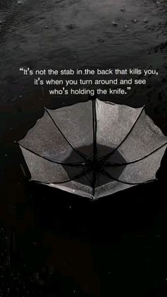 an umbrella floating in the water with a quote on it that says, it's not the stab in the back that lies you, it's when your turn around and see who's holding the knife