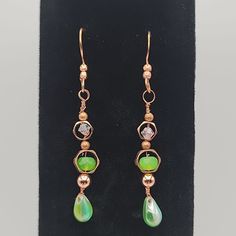 Nwt. Dangling Hook Earrings With Green Beads On A Copper Color. Earrings Measure 2.5" Copper Dangle Earrings For Party, Handmade Copper Earrings For Party, Party Copper Dangle Earrings, Green Teardrop Beaded Earrings With Wire Wrapped Detail, Green Teardrop Beaded Earrings With Wire Wrap, Czech Glass Beaded Drop Earrings, Green Teardrop Wire Wrapped Beaded Earrings, Green Wire Wrapped Teardrop Beaded Earrings, Beaded Copper Teardrop Jewelry