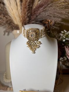 Capture the lush magnificence of India with this stunning Indian necklace set. From classic Pakistani jewelry to modern wedding jewelry designs, this necklace set will add a touch of sophistication to your Bollywood-inspired look. Accented with delicate gold choker stones and intricate polki earrings, this elegant piece of Indian jewelry is perfect for any eid or special occasion. Elevate your style and express yourself with this gorgeous Indian choker set. Elegant Gold Plated Jewelry Sets With Pendant, Elegant Gold-plated Jewelry Sets With Pendant, Intricate Design Choker Necklace For Diwali, Intricate Choker Necklace For Diwali, Diwali Choker Necklace With Intricate Design, Elegant Round Jewelry With Stone Work, Elegant Bridal Necklace With Tilla Pendant, Elegant Round Stone Work Jewelry, Elegant Jeweled Choker For Formal Occasions