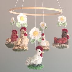 This handmade chicken mobile features colorful designs with white daisy flowers, perfect for adding a touch of whimsy to any nursery or baby room. The mobile is ready to ship and is sure to brighten up any space. The brand is handmade, and the color is white, making it a unique addition to any collection. It is ideal for babies and young children and will make a great gift for a newborn. This nursery mobile perks interests in babies and toddlers. Creates a beautiful and entertaining environment for babies and toddlers. This nursery mobile offers you its best quality, looks great, and feels great due to its soft material. Things to know - The hanger of this mobile is 12". - Prepared to be hung (loop at top) but does not provide a hook. - No chemical wool. Chicken Nursery Theme, Daisy Baby Nursery, Daisy Nursery Theme, Chicken Nursery, Farm Animals Nursery Theme, Farm Themed Nursery, Barnyard Nursery, Farm Nursery Theme, Flowers Nursery