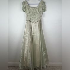 True Vintage Rebecca Ethereal Fairy Sage Green Corset Top Iridescent Skirt Maxi Dress. Size Small. Corset Style Lace Top With Lace Up Tie On The Back. Back Zipper. Short Sleeves. Princess Style Skirt With Three Layers - Iridescent Sheer Fabric On Top, Satin Lining, And Tulle. Fit And Flare Silhouette. Approximate Measurements: Width: 16” Arm Pit To Arm, 14” Waist Flat Lay Length: 44” Waist To Bottom Hem Tags: Wedding * Bridal * Mother Of The Bride * Mother Of The Groom * Bridesmaid * Gala * Even Sage Green Corset Top, Iridescent Skirt, Green Corset Top, Small Corset, Fairy Corset, Ethereal Fairy, Giambattista Valli Dress, Green Corset, Top Satin