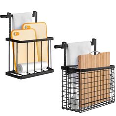 two black metal baskets with cutting boards and utensils in them, one holding paper towels