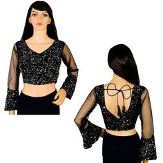 Item Description Beautiful Women's Velvet Sequins V-Neck Net Sleeves Ethnic Designer Blouse Fabric:-Velvet Sequins Color:-Black Sale For:-1 Blouse Closure Type:-Back Hook & Eye With Dori Sleeves Type:-3/4 Sleeves Neck Style:-V-Neck Product:-Padded Blouse With Cotton Inner Lining Care Instructions:-Hand Wash or Dry Clean Only Disclaimer:-The Actual Color Of The Product Slightly Vary From The Image Due To Photographic Light Or Monitor's Display. Measurement Sleeves Length:-21.5 Inch Front Neck Depth :-8 Inch Back Neck Depth :-11.5 Inch Ethnic Sequins Work Velvet Designer Blouse Net Sleeves To Give Yourself A Splendid Traditional Makeover! A Perfect Match For Your Grand Sarees.Pair This Ready To Wear Blouse With Any Type Of Saree In Various Occasions.This Would Be Classy Yet Fashionable Choic Traditional V-neck Sharara For Party, Festive V-neck Georgette Blouse Piece, Festive Georgette V-neck Blouse Piece, Traditional V-neck Party Sets, Party V-neck Traditional Wear With Zari Work, Fitted V-neck Lehenga For Navratri, Fitted V-neck Dress With Mirror Work, Long Sleeve Georgette Blouse With Sequins, Black Georgette Blouse For Party