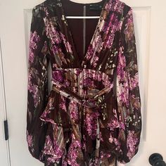 Never Worn. Asos Brown And Purple Floral Mini Dress Is Perfect For A Fall Wedding Or Semi Formal Event. Have Balloon Sleeves, Slight Open Back, Buttons In The Front For Extra Coverage, And 2 Adorable Accent Belts. Great Quality. Purple Floral Dress For Party, Fitted Mauve Floral Print Dress, Purple Flowy Dress For Date Night, Flowy Purple Dress For Date Night, Purple Flowy Mini Dress For Party, Flowy Purple Mini Dress For Party, Fitted Denim Dress, Lace Pencil Dress, Navy Blue Lace Dress