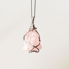 Rose Quartz Wire Wrapped Necklace  w 925 Sterling Silver Details: Gemstones: Rose Quartz Gemstone dimensions: 0.8"-1.2" (20-30 mm)  Material: 925 Sterling Silver Total necklace length: 16" /40 cm + extends to 18" /45 cm Rose Quartz, a gentle pink gem, embodies love and compassion. It resonates with the heart chakra, fostering emotional healing and self-love. Wearing Rose Quartz invites a sense of tenderness and inner harmony. ... Check out the full catalogue of raw wire wrapped crystal pendants Rose Gold Sterling Silver Pendant Crystal Necklace, Rose Quartz Gemstone Pendant Jewelry, Rose Gemstone Jewelry As A Gift, Rose Gemstone Jewelry For Gift, Rose Quartz Pendant Jewelry Gift, Pink Rose Quartz Birthstone Necklaces, Rose Quartz Natural Stones Jewelry Gift, Rose Quartz Natural Stones Jewelry For Gift, Pink Sterling Silver Crystal Gemstone Necklace