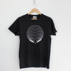 Black Short Sleeve Tops With Geometric Pattern, Black Cotton Tops With Geometric Pattern, Black Cotton Top With Geometric Pattern, Modern Black T-shirt, Black Crew Neck Top With Abstract Print, Modern Short Sleeve Tops With Geometric Pattern, Casual Geometric Graphic Print Tops, Modern Black Tops With Graphic Design, Modern Black T-shirt For Summer