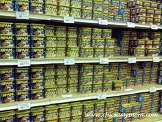 shelves in a grocery store filled with lots of different types of food and snacks on display