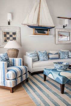 a living room with blue and white striped furniture