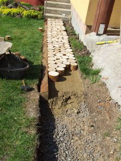 there are many logs that have been placed on the ground to be used as a fire pit