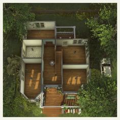 an aerial view of a house in the woods