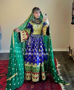 Elevate your wardrobe with this exquisite Afghan dress, crafted from high-quality used banras fabric. This unique piece features intricate charma work, showcasing the artistry and tradition of Afghan craftsmanship.  The dress comes with a generous 3-meter bridal scarf, perfect for adding an elegant touch to your ensemble. The primary color of this stunning dress is a vibrant blue, but it is available in a variety of colors to suit your personal style. Additionally, it includes a beautiful green Beautiful Afghan Dress, Tajikistan Dress, Vintage Afghanistan, Bridal Scarf, Afghan Style, Afghani Clothes, Afghan Dress, Afghan Wedding, Afghan Girl