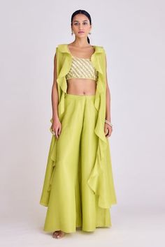 Lime longline tissue cape in a ruffled pattern. Comes with solid sharara and sequins, thread work, cutdana embroidered padded blouse. - Aza Fashions Fitted Ruffled Palazzo Set For Festive Occasions, Festive Fitted Palazzo Set With Ruffles, Sleeveless Ruffled Set For Reception, Sleeveless Ruffled Reception Set, Spring Ruffled Sets For Receptions, Spring Reception Ruffled Sets, Spring Reception Sets With Ruffles, Spring Sharara With Ruffles, Spring Festive Sharara With Ruffles