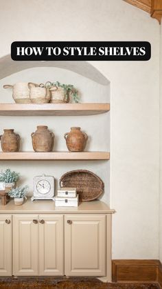 some shelves with pots and vases on them