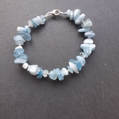 Beautiful Aquamarine chip and Silver Bead Bracelet - Sterling Silver Perfect wear with any outfits and great gift for any occasion :) Please check pictures for exact measurements: Bracelet is 17 cm (6  3/4 inches) long Aquamarine chips are between 5-10 mm You may find matching items in the shop. Made with love in a smoke and pet free home. Thank you for your interest in my items :) Home Made Bracelet, Afro Jewelry, Surf Jewelry, Pretty Jewelry Necklaces, Ocean Jewelry, Silver Bead Bracelet, Stacked Jewelry, Jewelry Lookbook, Pretty Bracelets