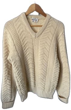 Classic Cream V-neck Sweater For Fall, Classic V-neck Textured Knit Sweater, Classic Cream V-neck Sweater For Winter, Winter White V-neck Sweater, Winter White V-neck Sweater For Winter, Classic Lambswool Sweater, Cozy Winter V-neck Polo Sweater, Classic Cream Polo Sweater, Wool V-neck Sweater For Winter