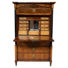 an antique wooden dresser with drawers and mirror