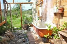 a bathtub sitting on top of a wooden deck