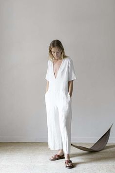 Relaxed yet feminine and flattering the june jumpsuit from our classics collection is a one-piece jumpsuit with a plunging v-neckline. the june has slanted front pockets and back inseam pockets for convenience and features zii ropa's raw hem finishing.    - 100% linen  - 3 button closure at back  - size down for a slimmer fit  - model is wearing size s and 5'8  - made in mexico Chic V-neck Relaxed Fit Jumpsuits And Rompers, Elegant Jumpsuits And Rompers With Pockets And Relaxed Fit, Chic V-neck Jumpsuits And Rompers With Relaxed Fit, Female Jumpsuit, Caged Sandals, México City, Boutique Sales, Minimalist Chic, Working Mother