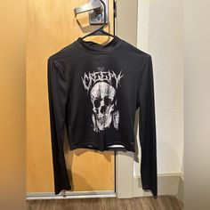 Black Skull Shirt! Never Worn. Fitted Black Shirt For Streetwear, Urban Black Tops For Halloween, Urban Long Sleeve Tops For Concerts, Black Long Sleeve Tops With Skull Print, Black Punk Shirt With Skull Print, Black Skull Print Shirt For Streetwear, Edgy Black Shirt With Skull Print, Black Grunge Skull Print Tops, Black Edgy Shirt With Graphic Print