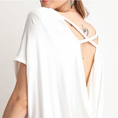 - Ultra Soft And Lightweight Crepe Viscose Fabrication - Low Cowl Back With Braid Detailing Loose Fit Knit Tunic Top - Model Height 5'10" - Fabric: Knit - Content: 96% Viscose, 4% Spandex - White Viscose Beach Tops, Elegant Viscose Tops For Beach, V-neck Tie Back Tops For Day Out, Tie Back V-neck Top For Day Out, White Viscose V-neck Top, Summer Stretch Blouse For Loungewear, Summer Stretch Loungewear Blouse, White Stretch Top With Tie Back, White Viscose Top For Day Out