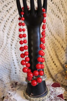 Fancy vintage red beaded double strand necklace is a great accent piece for dressing up an outfit or for a more casual look! Necklace is in good vintage condition showing minimal wear for its age. Please see all photos as this is part of description. Measurements: approx. 7" long. Weight: 2.1 oz. Red Double Strand Faceted Beaded Necklaces, Red Double Strand Faceted Beaded Necklace, Red Double Strand Beaded Necklace With Faceted Beads, Red Double Strand Beaded Necklaces, Red Double Strand Beaded Necklace With Polished Beads, Red Double Strand Jewelry With Colorful Beads, Red Double Strand Jewelry With Faceted Beads, Red Long Beaded Necklaces For Party, Red Double Strand Beaded Necklaces For Gift