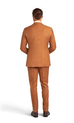 A slim caramel suit with two buttons and a notch lapel. Fitted Brown Tuxedo Blazer, Fitted Solid Suits For Fall, Solid Fitted Suits For Fall, Brown Tuxedo With Suit Collar For Semi-formal Occasions, Semi-formal Brown Tuxedo With Suit Collar, Fitted Brown Suits For Formal Occasions, Brown Semi-formal Tuxedo With Suit Collar, Formal Fitted Brown Suits, Brown Slim Fit Suit For Business Casual