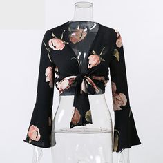 This sexy & sassy floral cropped top is sheer perfection. Made with a cotton & polyester blend and featuring a plunging v-neckline, a tie-up front and flare sleeves this top pairs perfectly with pants, skirts, shorts, jeans or leggings. Egirl Fashion, Black Shirts Women, Short Blouses, Flare Sleeves, Collars For Women, Women Blouses, Spring Tops, Party Tops, Shorts Jeans