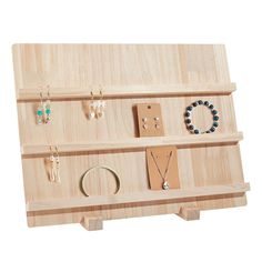 a wooden display with jewelry on it