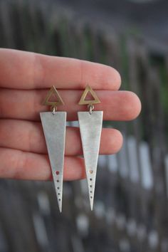 Finish : Matte Metal : Sterling silver and bronze or all sterling silver with gold plated triangle-sterling silver posts and backs If you have any question please send me, I will reply to you as soon as possible! Please allow 3-6 Work Days from purchase for me to create them.As soon as I send them,you will receive an e-mail with the shipment details.For the european orders the products will arrive in 4-7 days and for the rest of the world 10-15 days. Do no hesitate to contact in case you have an Kite Earrings, Simple Silver Earrings, Triangle Jewelry, Metalsmithing Jewelry, Wire Work Jewelry, Earrings Inspiration, Work Jewelry, Triangle Earrings, Silver Jewelry Handmade