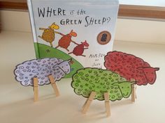 there is a children's book about green sheep on the table next to it