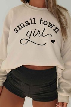 SMALL TOWN GIRL OVERSIZED GRAPHIC SWEATSHIRT The oversized sweatshirt trend has been seen on runways and street style icons alike. Made from high-quality cotton, this Small Town Girl sweatshirt is a cozy and stylish option for any wardrobe.PREMIUM COTTONOVERSIZED FIT Maxi Romper, Small Town Girl, Collar Sweater, Girl Sweatshirts, Oversized Sweatshirt, Zip Sweater, Denim Pant, White Sweatshirt, Cardigan Jacket