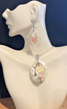 "Mother of Pearl Pendant Necklace Set , Mother of Pearl Necklace & Earrings , Floral , Crystal , Abalone Jewelry set for Women Beautiful Oval Shell Pendant with Yellow & Peach flowers and crystal on a 20 \" sterling silver chain  . 2 1/2 \" long x almost 1 1/2 \" wide. Matching earrings hang 2 \" long. IF YOU WANT A DIFFERENT SIZE NECKLACE PLEASE LET ME KNOW ! I do not accept returns. Sales are final !" Oval Pendant Jewelry Set As Gift, Abalone Jewelry, Pearl Necklace Earrings, Mother Of Pearl Jewelry, Pearl Jewelry Sets, Mother Of Pearl Necklace, Peach Flowers, Pretty Necklaces, Pearl Pendant Necklace