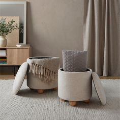 two round stools sitting on top of a white rug