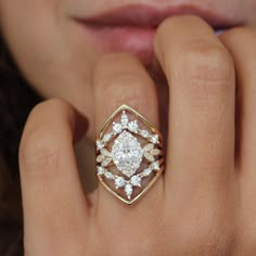 a close up of a person wearing a ring with diamonds on it's fingers