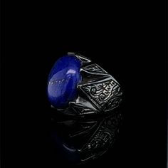 The elegant, smooth-textured Lapis Lazuli gemstone is much more than an eye-catching jewelry stone. It is said to have immense healing and spiritual properties. Those purchasing these pieces will not only have the satisfaction of owning and wearing something special, but also allowing someone to continue creating something that they love. Tim's Silver gives you the meaning and the properties of this gemstone ring. PRODUCT DETAILS Metal: 925 Sterling Sİlver and Black Rhodium plated. Gemstone Type Luxury Lapis Lazuli Oval Rings, Formal Lapis Lazuli Gemstone Ring, Lapis Lazuli Signet Ring With Gemstone For Gift, Luxury Oval Lapis Lazuli Rings, Luxury Lapis Lazuli Gemstone Rings, Formal Lapis Lazuli Oval Rings, Oval Lapis Lazuli Rings For Formal Occasions, Luxury Rings With Natural Stones, Luxury Lapis Lazuli Rings