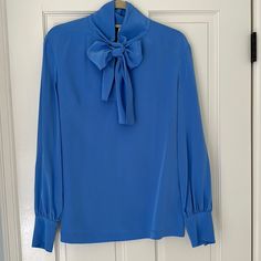 Brand New Condition Super Soft Silk Black Trim On Front Opening And Back Peep Hole Bow Ties Beautifully Many Ways To Wear It Blue Fitted Blouse With Tie Neck, Blue Fitted Tie Neck Blouse, Blue Long Sleeve Silk Top, Blue Silk Formal Tops, Formal Blue Silk Tops, Blue Tie Neck Tops For Spring, Blue Silk Long Sleeve Top, Blue Fitted Tie Neck Tops, Blue Silk Long Sleeve Blouse