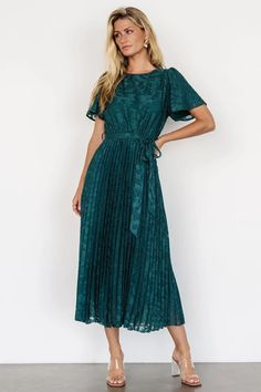 Step into sophistication with the Mindy Pleated Dress in deep emerald green. Faux applique florals, bloused bodice, flutter sleeves, and ankle-length pleated skirt ensure timeless elegance, with a natural waist, detachable sash, and full lining for comfort. Lurex Dress, Tulle Midi Dress, Tulle Material, Tiered Midi Skirt, Baltic Born, Ankle Length Skirt, Velvet Maxi Dress, Tulle Sleeves, Tie Skirt