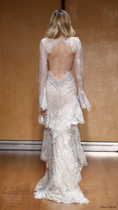 the back of a wedding dress with long sleeves