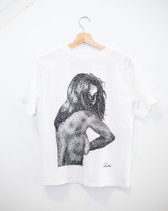 This is my original artwork design! It uses the stippling technique of placing thousands of individual dots on the paper. The artwork was then scanned and screen printed by hand onto the t-shirts. The t-shirts are high quality and were sourced from AS colour. They are light weight (150 gsm) with a very cool, smooth texture. The Women's tee is a cube shape offering a slightly shorter body length, and "boxy" fit for those who like a casual look without being oversized. The Men's tee is a standard Hand Printed Graphic Tee With Short Sleeves, Hand Printed Graphic Tee With Crew Neck, Hand Printed Crew Neck Graphic Tee, Unisex White Print T-shirt With Screen Print, Unisex White Screen Printed T-shirt, Relaxed Fit T-shirt With Custom Artwork For Artistic Expression, Artistic Unisex Screen Print Tops, Graphic Tee With Sublimation Print For Artistic Expression, Stippling Technique