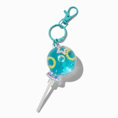 This super adorable keychain is a must-have accessory for any set of keys, backpack, purse, and more! Water-filled design is the perfect way to show you're an eclectic girlie that loves her glitter.Water-FilledAttached clipMaterial: Metal - Claire's Blue Lollipop Water-Filled Glitter Keychain