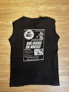 Vintage She Devil Tank  Measurements (Inches)  Length: 27   Width: 20 If you have any questions on a product, feel free to contact us.  Instagram: MemoriCrd Imperfections are shown in photos. Each piece in our store is vintage. All items are pre-owned and may show signs of wear. Vintage Sleeveless T-shirt With Graphic Print, Vintage Muscle Tee With Crew Neck For Streetwear, Vintage Graphic Print Muscle Tee With Crew Neck, Vintage Cotton Muscle Tee With Graphic Print, Vintage Cotton Muscle Tee With Crew Neck, Vintage Cotton Crew Neck Muscle Tee, Retro Muscle Tee With Graphic Print And Crew Neck, Retro Graphic Print Muscle Tee With Crew Neck, Retro Crew Neck Muscle Tee With Graphic Print