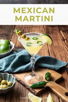 the mexican martini is garnished with limes and jalapenos