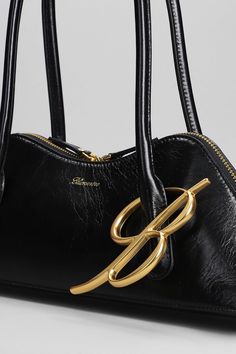 Hand bag in black leather, metallic logo, gold hardware, double handle, zip clousure, engraved logo, adjustable shoulder strap, metal feet at base, 100% leather, Made in Italy, Height 80 mm, Width 340 mm | Blumarine Women's Hand Bag in Black Leather | SS24 Engraved Logo, Metallic Logo, Playful Design, Luxury Retail, Hand Bag, Luxury Boutique, Gold Hardware, Gold Metal, Shoulder Strap