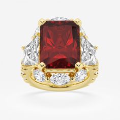 a red and white diamond ring set in yellow gold