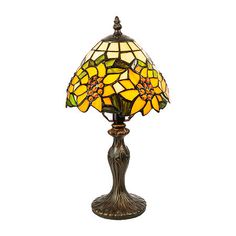 a table lamp with a yellow flower on it's glass shade, sitting on a white background