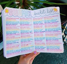 someone holding up a summer bucket list