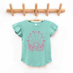 Looking for a cute tee for your daughter? We have the perfect flutter sleeve graphic tee. Cute Summer T-shirt With Ruffle Sleeves, Pink Ruffle Sleeve T-shirt, Playful Cotton Top With Flutter Sleeves, Playful Cotton Tops With Flutter Sleeves, Playful Pink Flutter Sleeve Tops, Sun Child, Little Miss Sunshine, Top Graphic Tees, Kids Outfits Girls